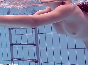 Lucy takes off bikini in the pool